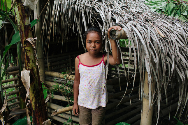 Timor-Leste – young girl near hut