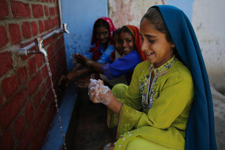 Najma (9) washes her hands with soap; using water from a newly installed WaterAid supported WASH facilities in Mohammad Nohrio village in Badin District, Sindh Province Pakistan.