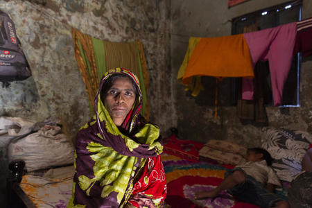 Portrait of Mst. Sharifa (35), who is a climate migrant from Jamalpur, inside her house in Outfhol Pora Basti (slum), Jatrabari, Dhaka, Bangladesh.