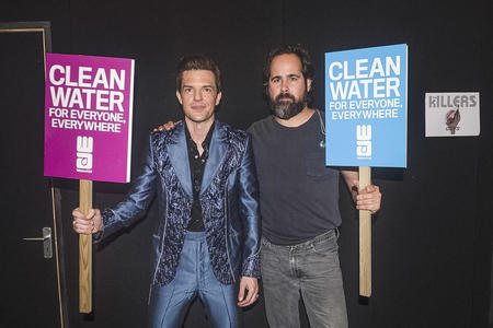 Brandon Flowers and Ronnie Vannucci of American rock band 'The Killers' supporting WaterAid's #accessdenied campaign at the 2019 Glastonbury Festival. 