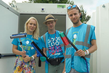 WaterAid volunteers cleaning the showers at Greenman Festival