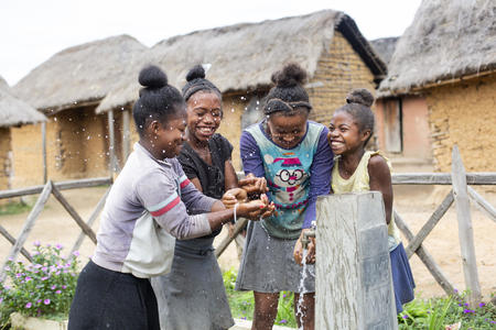 “I am made of FRIENDS – WATER – FISHERGIRL – FAMILY.” Ifaliana, 11 (first from right), enjoying the water with her friends at the tap in Amberomena village, Belavabary commune, Alaotra Mangoro, Madagascar, May 2019.
