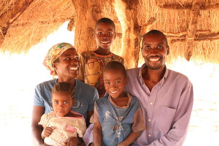 Family photo for Paul Chasulwa the Community Health Worker for Chikuni Village. He was with his wife Sarafina, Sons Brian and Patrick and daughter Beatrice, Monze, Zambia Nov 16