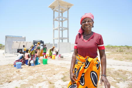 Molia Abdallah, 47, in front of a solar powered water scheme being constructed in Chicoma, Mossuril District, Nampula Province, Mozambique, October 2018.